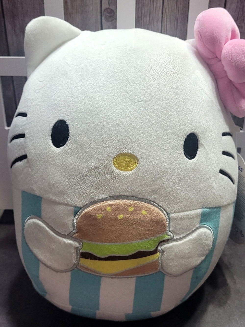 Hello Kitty Squishmallow Plush Wearing A Pink Bow And Holding A Hamburger